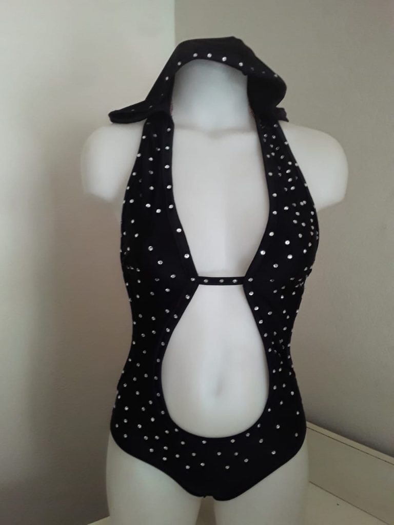 Rediscovering yourself sometimes means revisiting hidden talents. Photo of Black hooded seo suit designed by Claudette